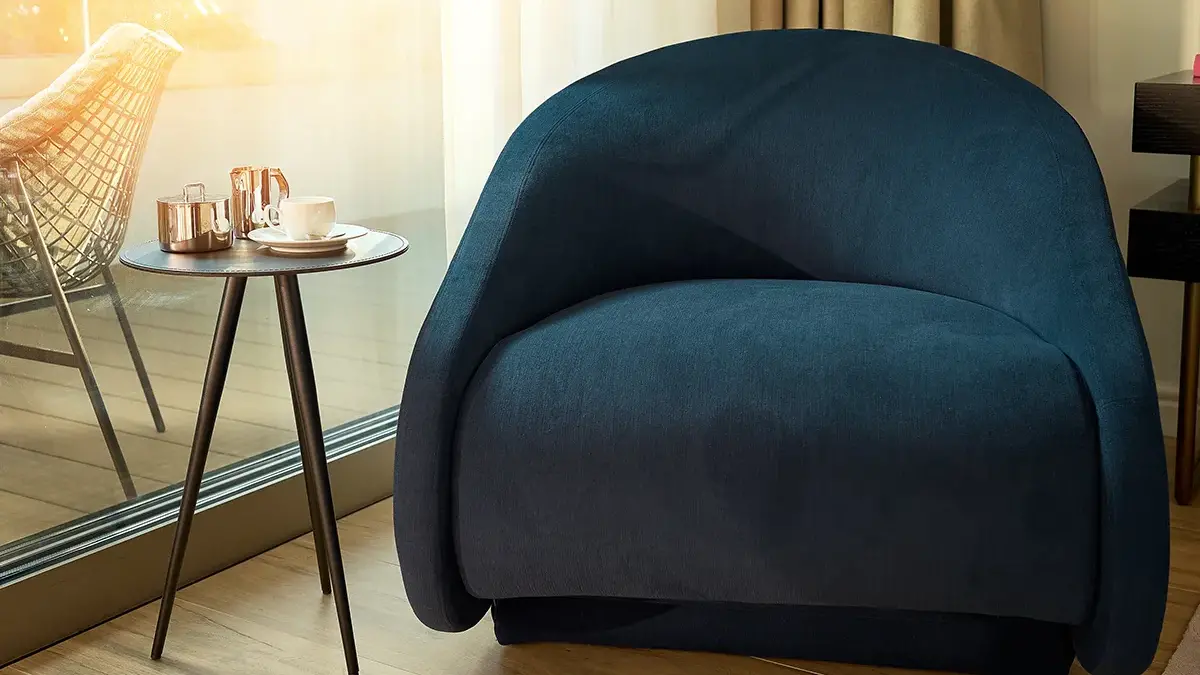 Plush comfortable chair in hotel room of Boutique Hotel Mirari