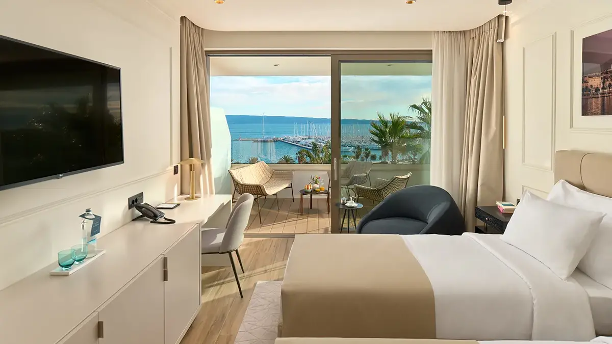 Twin bedroom in Boutique Hotel Mirari with open sea view.