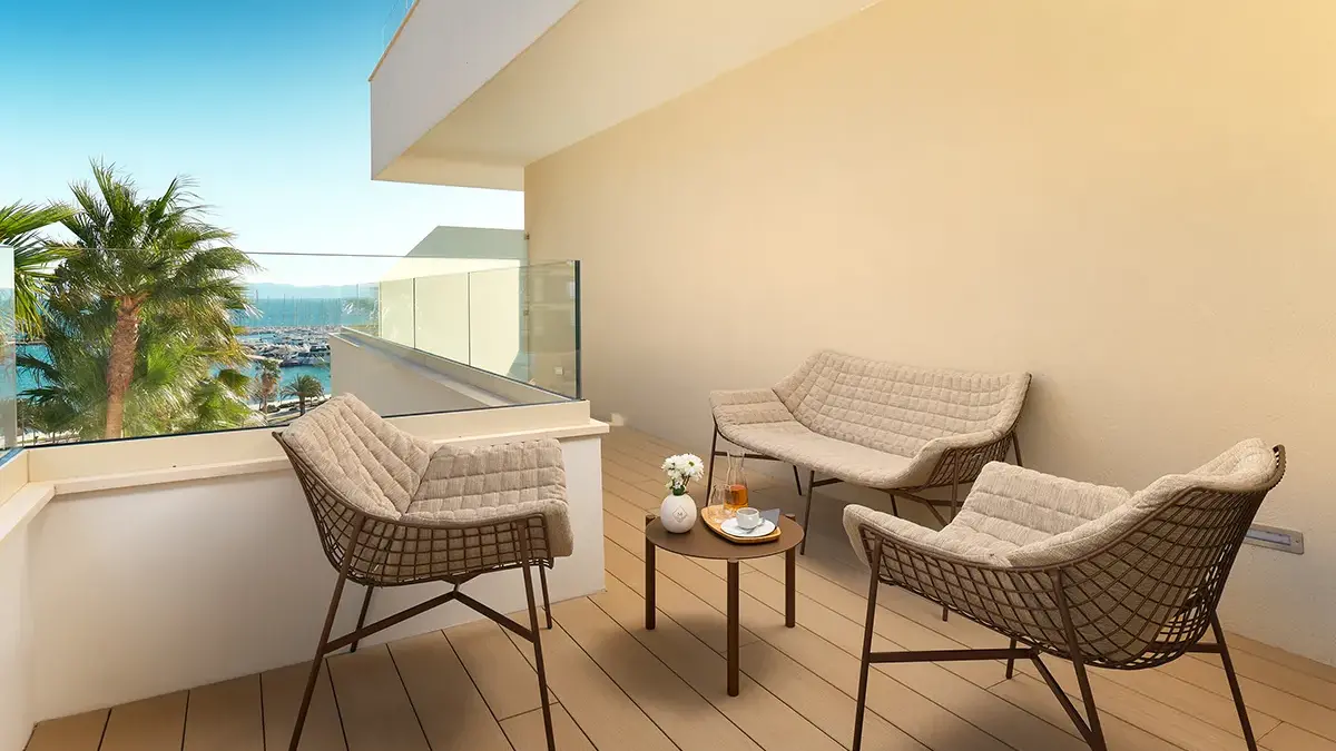 Balcony in Boutique Hotel Mirari with juice on the table and partial sea view